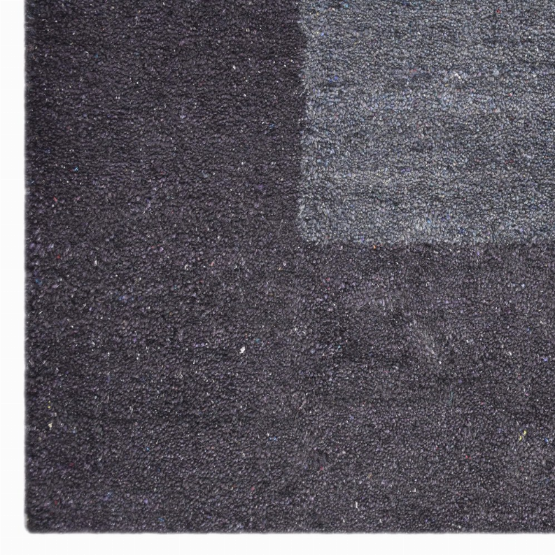 Textured silk-mix area rug, dark charcoal and gray surface with tight pile