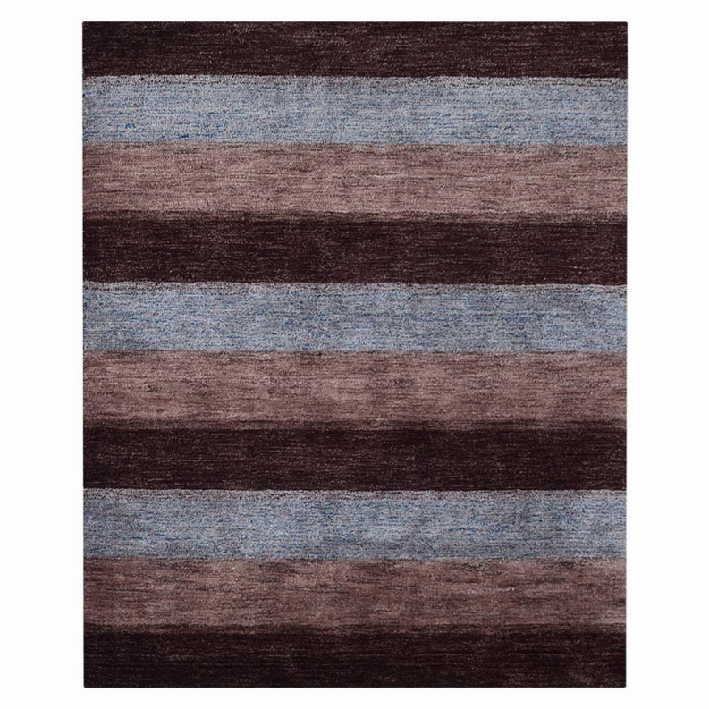 Close-up of a contemporary striped area rug with maroon, brown, and blue bands