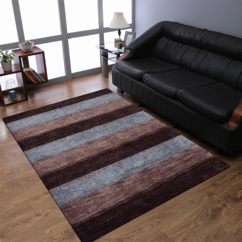 Striped area rug in maroon, brown, and blue horizontal bands in a living room setting