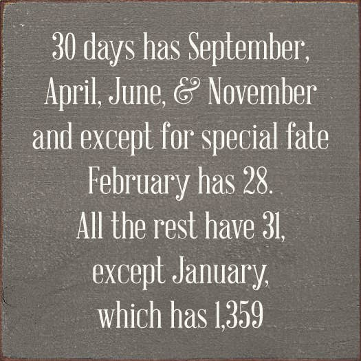 Slate-colored quote sign with white typography: “30 days has September…”
