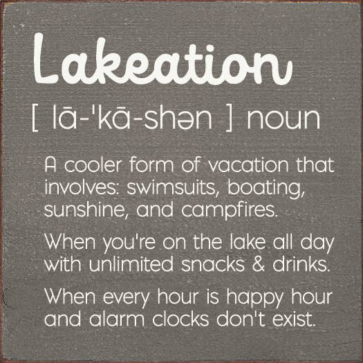 Lakeation definition sign with large white lettering on dark gray background