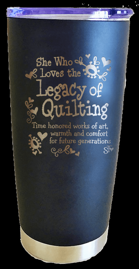 Blue tumbler with “Legacy of Quilting” lettering and cream base