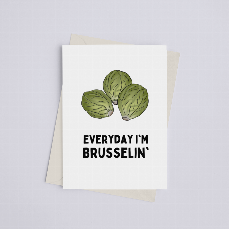 White greeting card with green brussels sprouts and bold 'Everyday I'm Brusselin''; beige envelope.