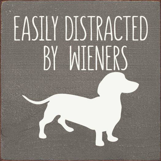 Dark gray dog sign with white dachshund silhouette and stacked phrase lettering