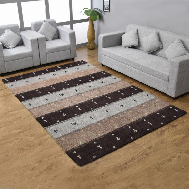 Area rug with bold striped pattern in dark brown, beige, and light gray
