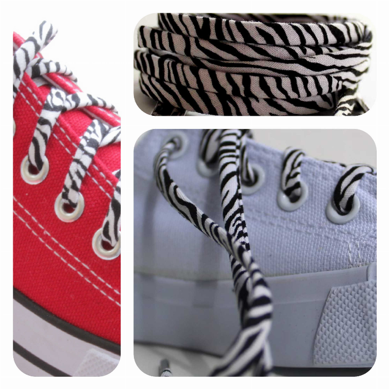 Zebra-print shoelaces on a light-blue sneaker with silver metal aglets