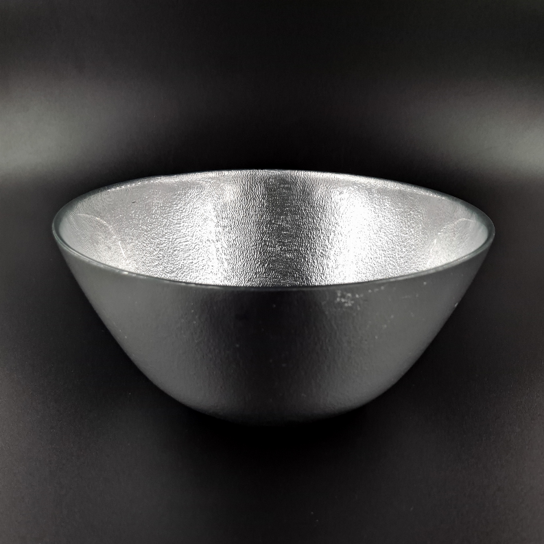 Silver metallic glass salad bowl with wide, shallow shape