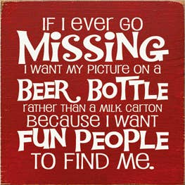 Red beer bottle-themed wood sign with bold white 'Missing' message and quote text.