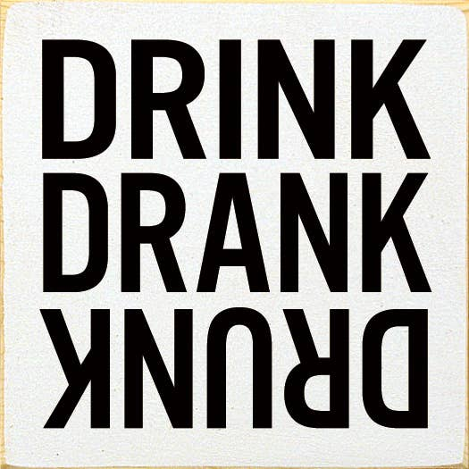 Square black text coaster reading 'DRINK DRANK DRUNK'