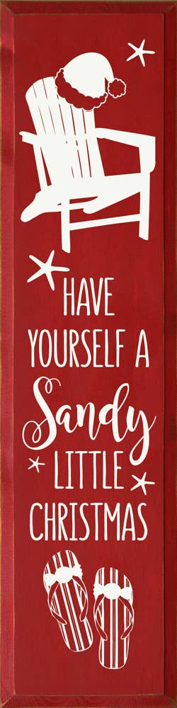 Framed Christmas wall art with Santa illustration and quote 'Have yourself sandy little Christmas'