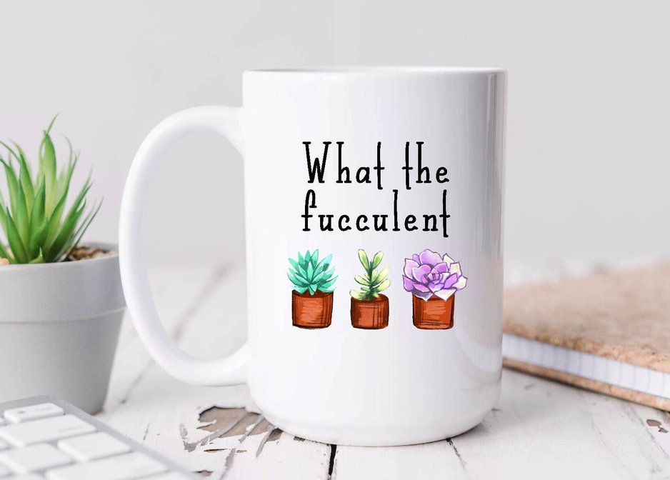White ceramic coffee mug with 'What the fucculent' text and three succulent pots