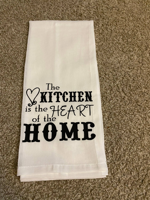 White tea towel with black "Kitchen" heart and "HOME" typography