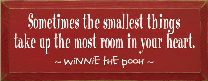 Red wood wall sign with motivational quote and Pooh text