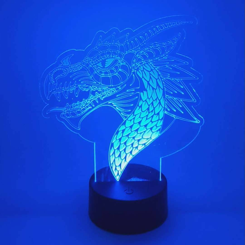 Dragon LED lamp with glowing blue acrylic dragon design on a black base