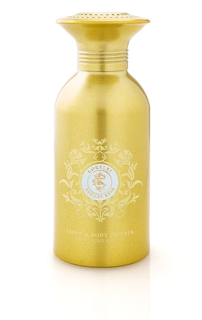 Gold powder bottle with white floral crest label and gold cap