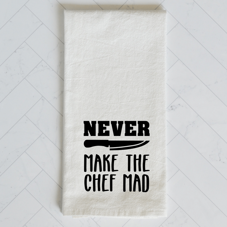 White kitchen towel with bold black slogan 'Never Make the Chef Mad' on front