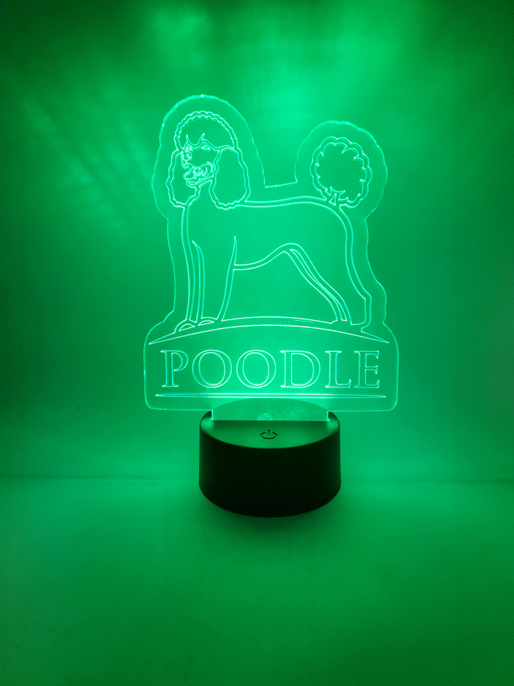 Black cylinder poodle LED lamp with round top and green glowing dog outline