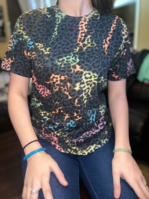 Rainbow leopard tie-dye tee with crew neck, short sleeves, worn by model