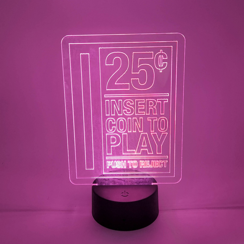 Arcade LED lamp with “25¢ Insert Coin to Play” marquee and round black base