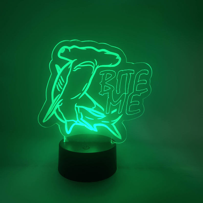 Shark LED novelty lamp with neon green bite text design on glowing base