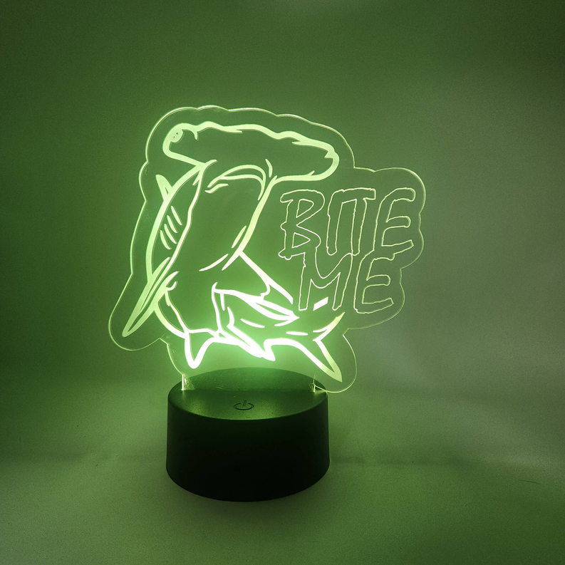 Neon green shark LED novelty lamp with “BITE ME” design on round base