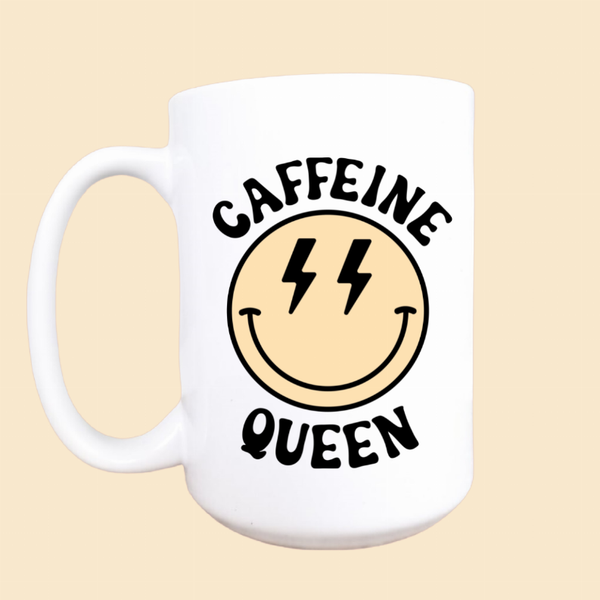 White ceramic coffee mug with smiling lightning face and CAFFEINE QUEEN text