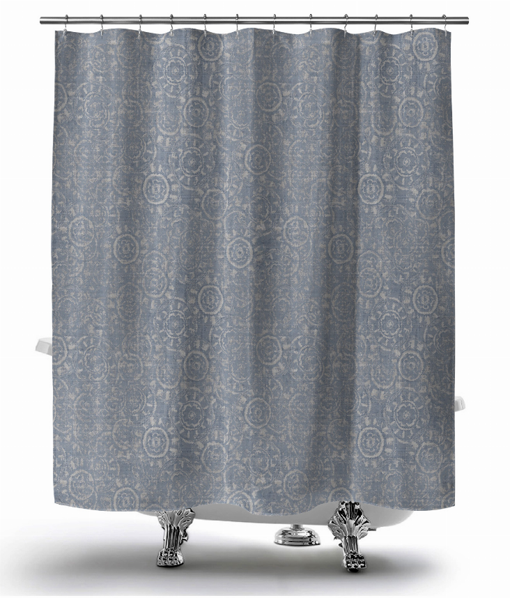 Blue patterned shower curtain with circular medallions and metal grommets