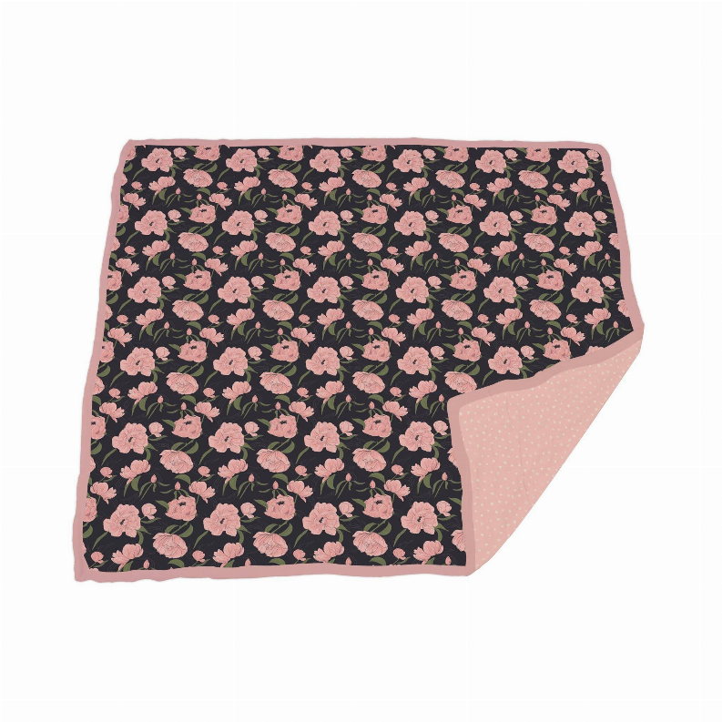 Bamboo blanket with pink floral print and light pink polka-dot underside