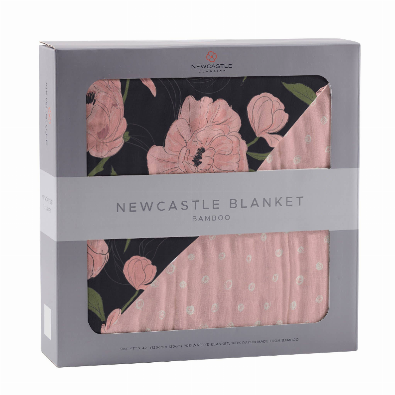 Bamboo blanket with large blush flowers and pale pink polka dots