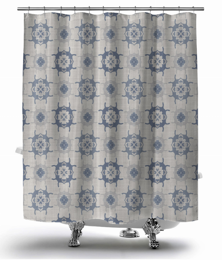 Blue and gray shower curtain with star medallion pattern and top grommet holes.
