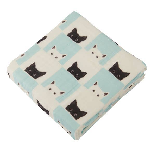 Cream baby blanket with light blue check pattern and black and white cat faces