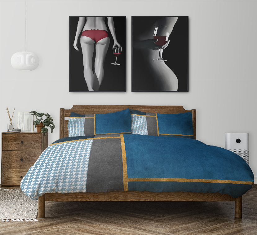Multicolor comforter set on bed with blue, gray, and white patterned pillows