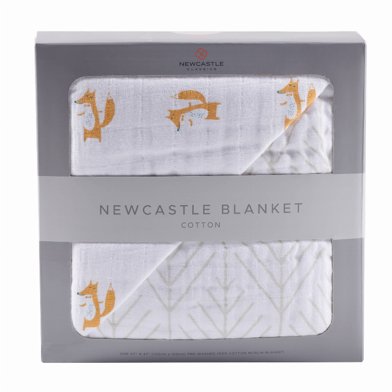 Newcastle cotton blanket with orange fox print and light leaf/arrow pattern, folded in box