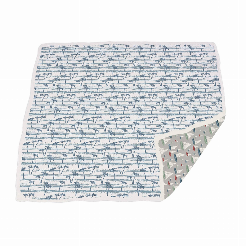 Bamboo blanket with blue ocean stripes and sailboat pattern, folded