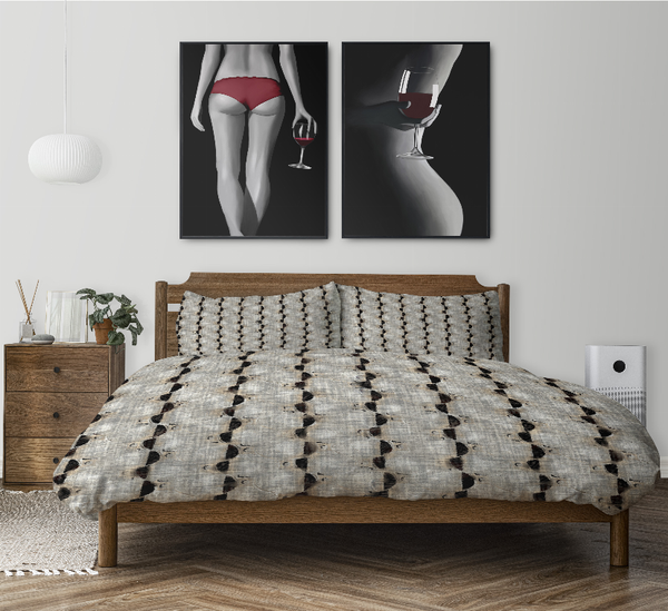 Comforter set with black-and-white patterned comforter and matching pillow shams