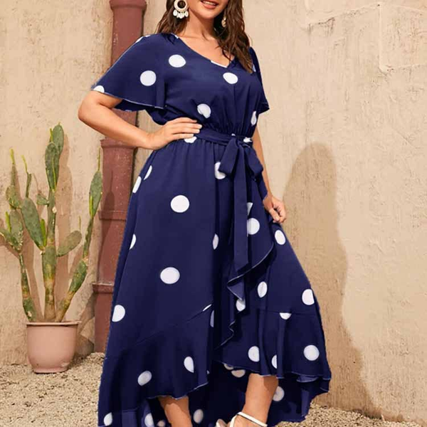 Plus-size navy polka-dot dress with tie waist and ruffle hem