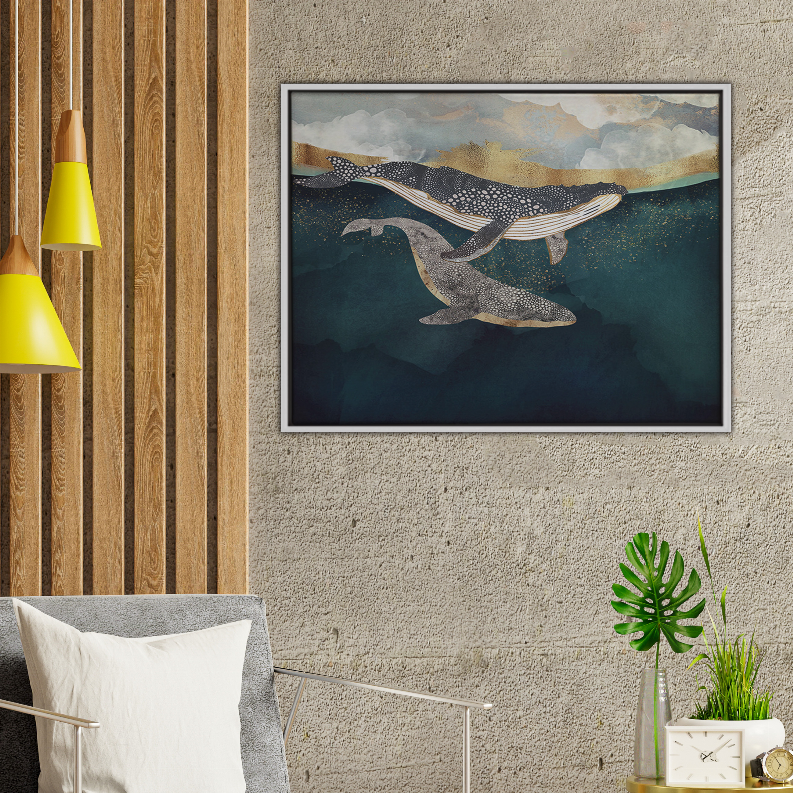 Framed whale art print with three whales over teal ocean and cloudy horizon
