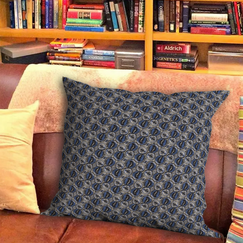 Blue throw pillow with repeating circular motif on sofa, square front