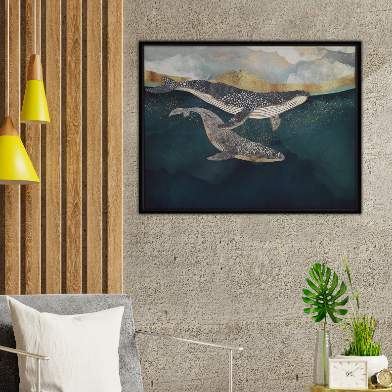 Framed art print of three whales swimming in ocean under cloudy sky.