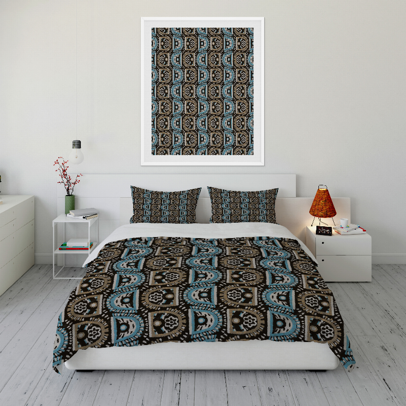 Comforter set with blue, teal, and black patterned comforter and two square pillows