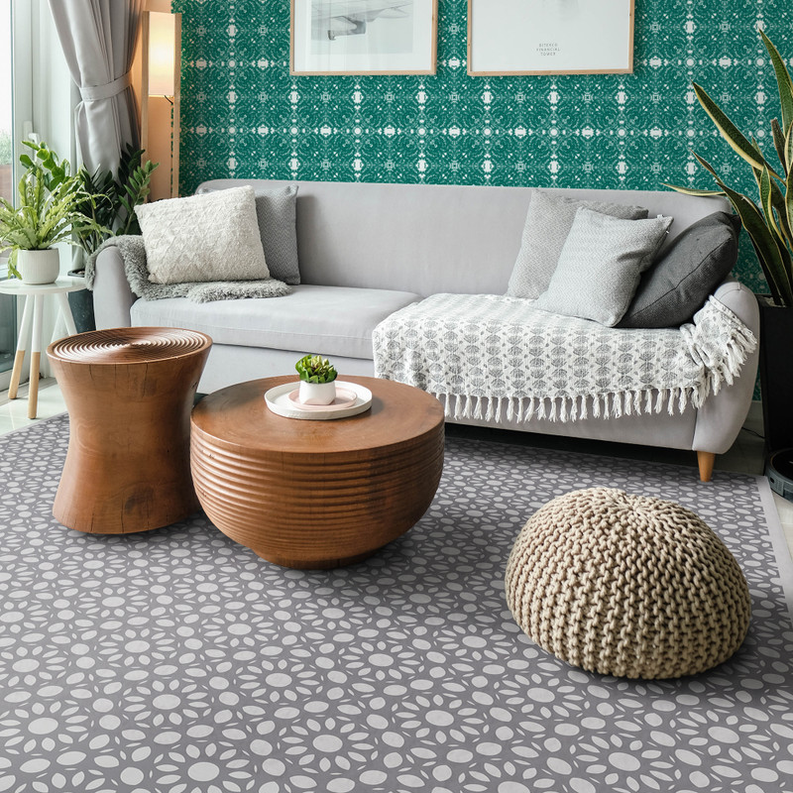 Teal wallpaper with repeating white lace-like geometric motifs