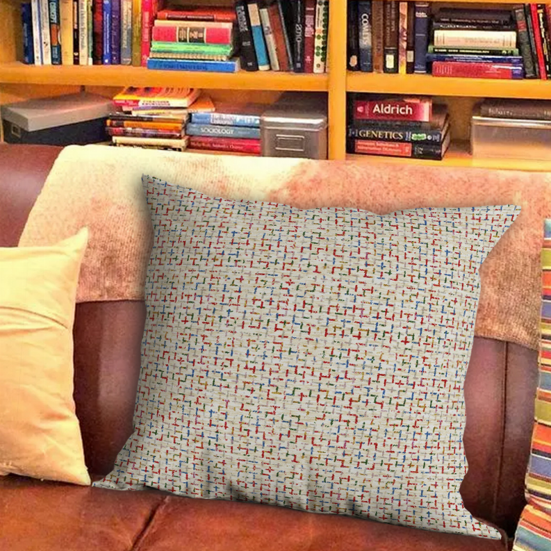 Decorative throw pillow with multicolor geometric grid pattern, off-white fabric