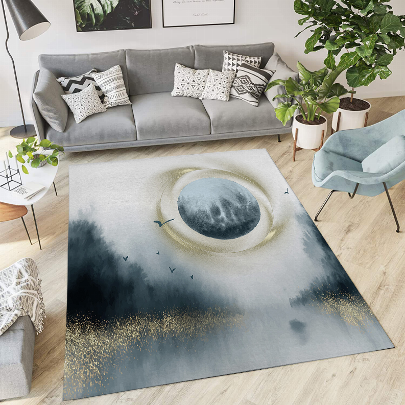 Low pile area rug with blue-gray celestial oval and gold speckle border