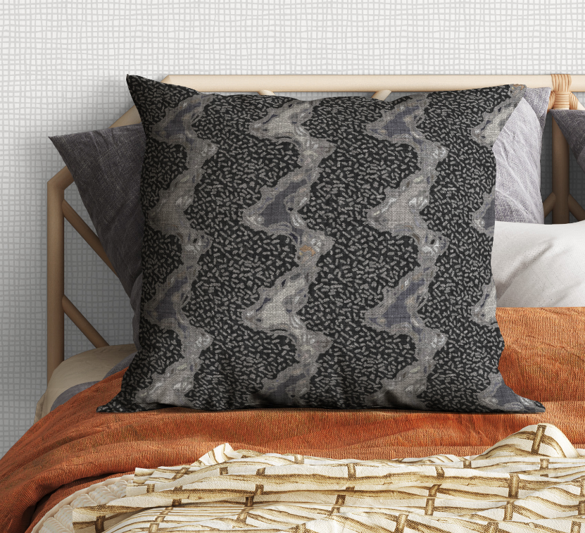 Decorative square pillow with dark charcoal and light gray abstract camo pattern