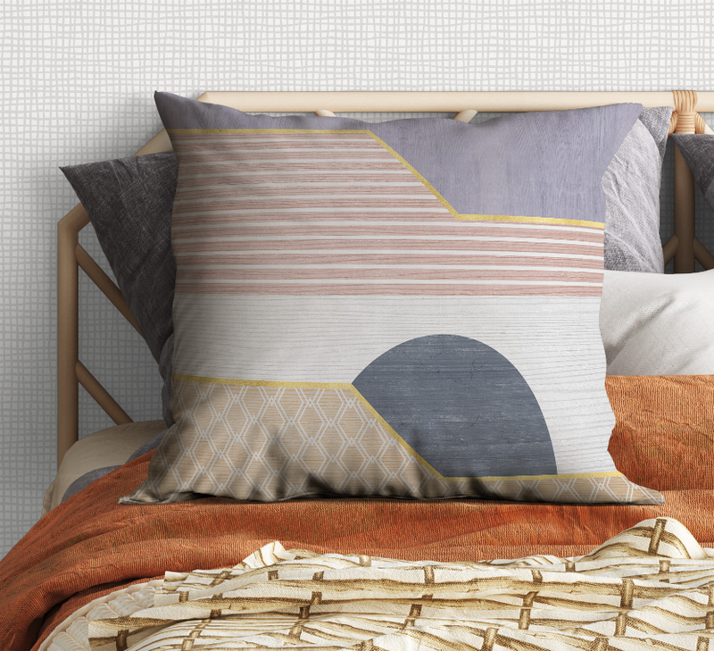 Geometric decorative pillow with blue circle, striped panel, and diamond border