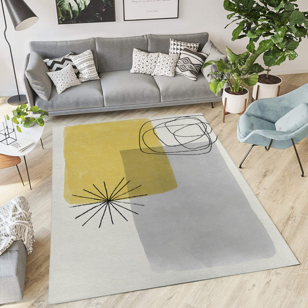 Abstract low-pile area rug with gray base, yellow block, and black line flower graphic