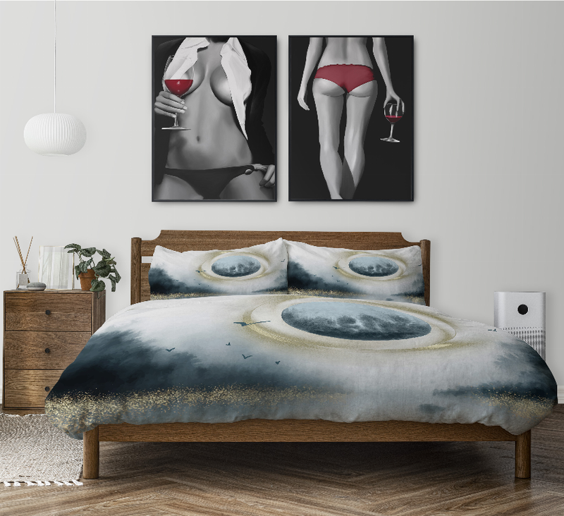Comforter set with blue abstract eye duvet, two shams, and folded gray throw