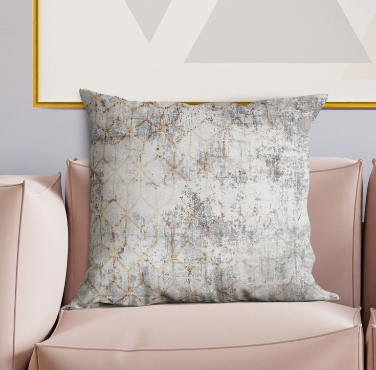 Geometric throw pillow, distressed light gray with gold lattice design