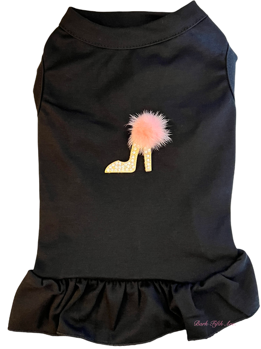 Black pet shirt with ruffled bottom, glitter high-heel graphic and pink pom-pom detail
