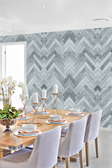 Chevron herringbone wood-look vinyl wallpaper panel in light blue and gray.